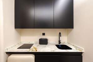 Fridge, microwave, stovetop, coffee/tea maker