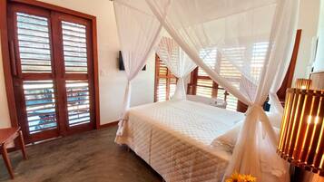 Deluxe Suite | 1 bedroom, blackout drapes, iron/ironing board (on request), travel crib