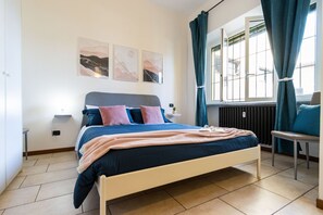 1 bedroom, desk, iron/ironing board, travel crib