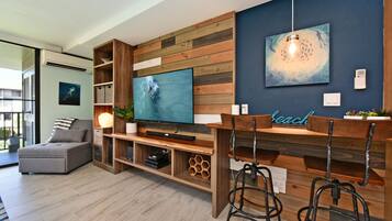Luxury Condo | Living area | 80-inch Smart TV with cable channels, Hulu, streaming services