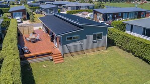 A modern residential area with multiple houses, each featuring a deck and a well-maintained lawn. - 27 Tuscan, Martinborough (Martinborough)