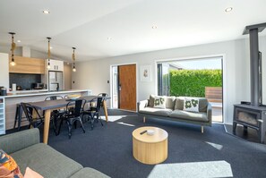 TV, fireplace - Relaxing Martinborough Escape | Spa, Seasonal Communal Pool & Indoor-Outdoor Living (Martinborough)