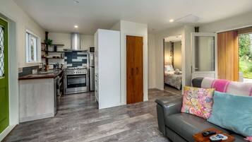 A modern interior with a kitchen, dining area, and living room.