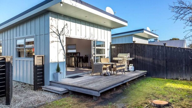 A modern house with a deck, outdoor seating, and a barbecue area. - TWO FOUR COLOGNE #4, Martinborough (Martinborough)