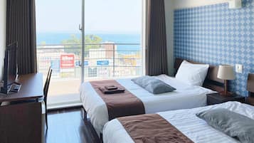 Habitación estándar con 2 camas individuales, 2 camas matrimoniales, para no fumadores | Wifi gratis y ropa de cama