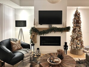 Smart TV, fireplace, table football, books