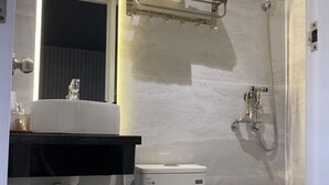 A modern bathroom with a toilet, sink, and shower. - Đông Như 3 (Ho Chi Minh City)