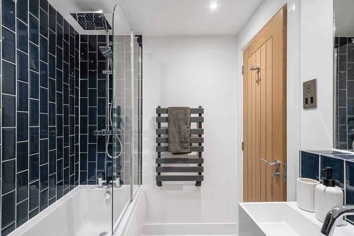 Bathtub, hair dryer, towels