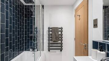 Bathtub, hair dryer, towels