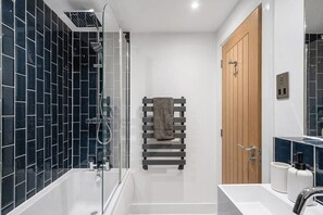 Bathtub, hair dryer, towels