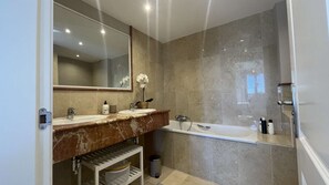 Bathtub, hair dryer, towels