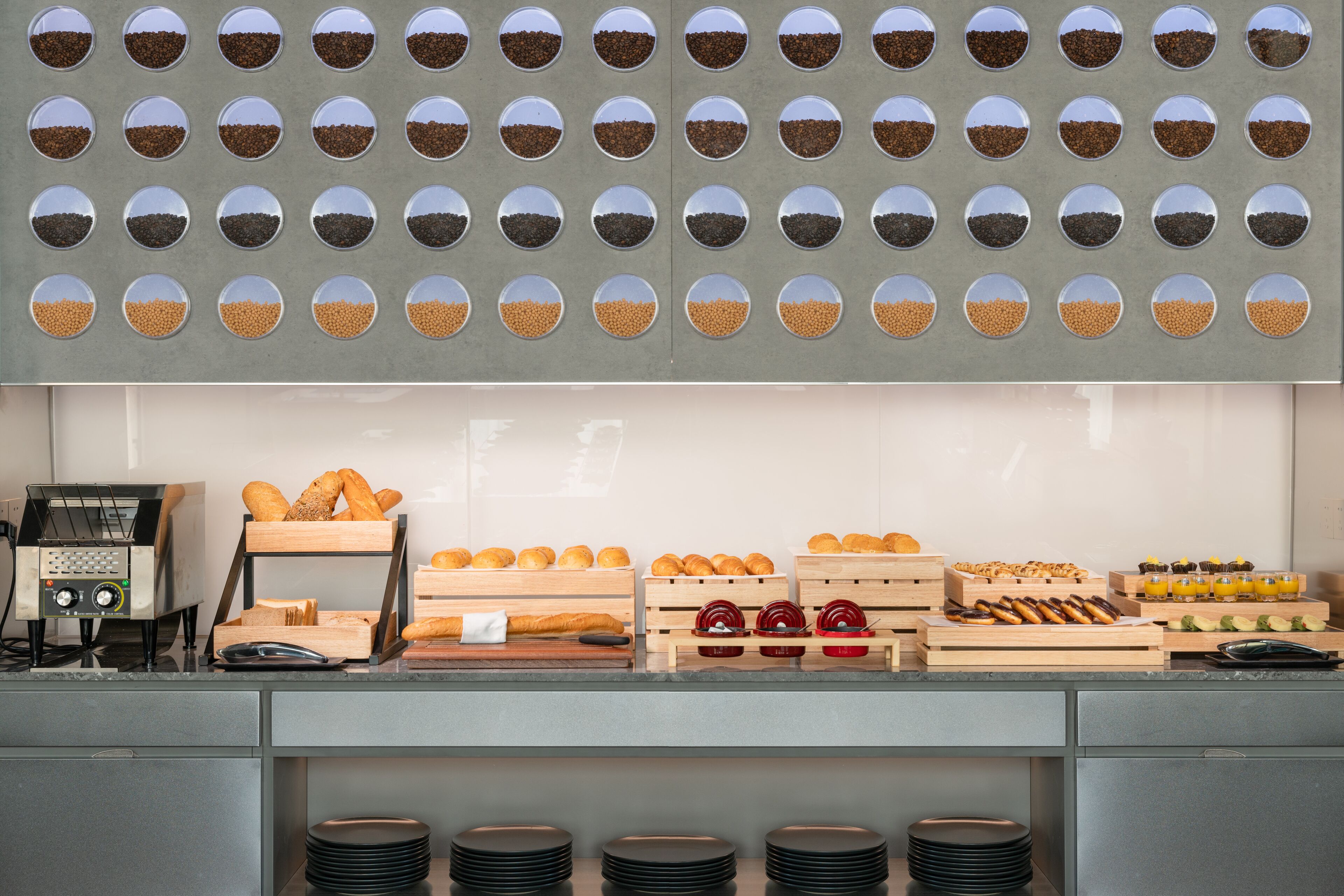 A bakery display with various breads and pastries.