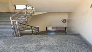 A staircase leading to the 3rd floor with a fire extinguisher on the wall. - MeroStay 141 Hotel RG (Kathmandu)