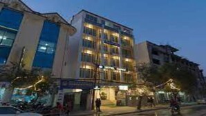 A multi-story hotel with a modern design, featuring a prominent entrance and several balconies. - MeroStay 159 Hotel AP (Kathmandu)