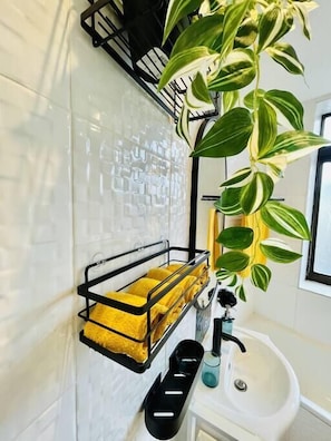 Bathtub, hair dryer, towels