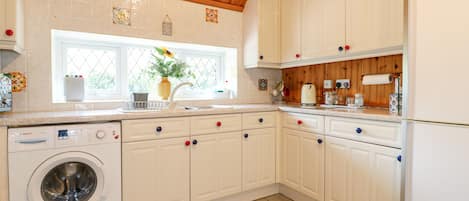 Fridge, electric kettle, toaster, cookware/dishes/utensils