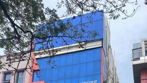 A building with a blue facade and a sign for CNR Residency. - CNR Residency Madanapalle (Madanapalle)
