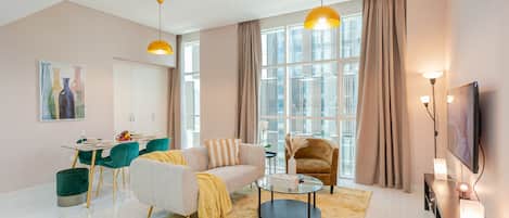 Deluxe Apartment | Living area | 55-inch Smart TV with cable channels, TV