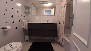 Bathtub, hair dryer, towels