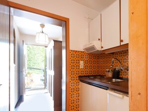 Fridge, stovetop, dishwasher, dining tables