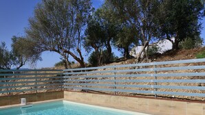 A rectangular swimming pool with clear blue water, surrounded by a tiled deck and a metal fence. - Villa with pool (Trappeto)