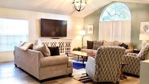 A living room with a sofa, armchairs, a coffee table, and a TV. - Ref 417.  Stunning villa in perfect location Close to Disney (Four Corners)