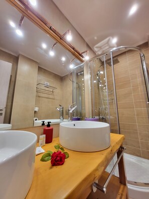 A modern bathroom with a large mirror, a round sink, and a shower area. - Bella Vita Boutique Hotel Lefkada (Lefkada)
