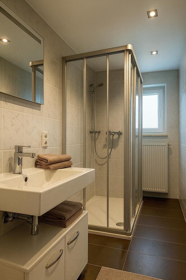 Shower, hair dryer, towels, soap
