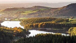 A panoramic view of a valley with a river, a bridge, and dense forested areas. - 2-bed House in Macclesfield Cheshire (Macclesfield)