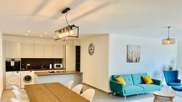 A modern apartment with a kitchen, dining area, and living room. - 2 bedrooms with Terrace and Parking (Luxembourg City)