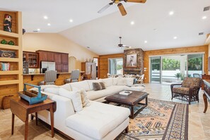 Smart TV, fireplace, books, printers