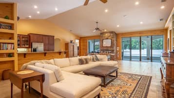 Smart TV, fireplace, books, printers