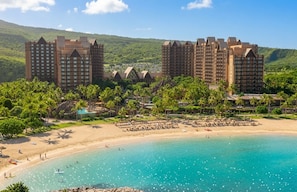 A resort with beachfront accommodation, a pool, and a beach area.