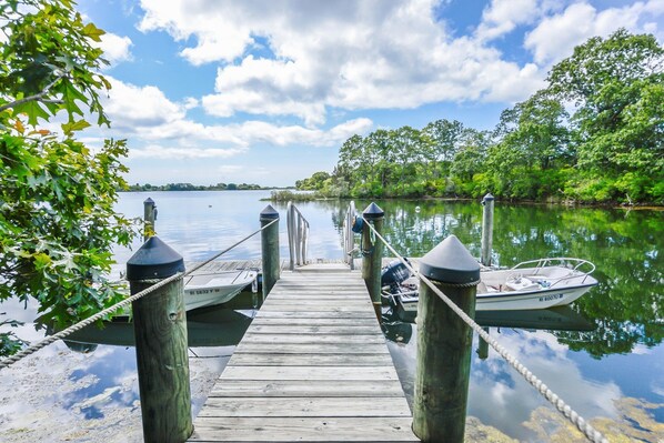 Guests can enjoy a serene lakeside experience with access to the water via the pier.