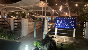 A restaurant sign for Paul Owens at the Beach House.
