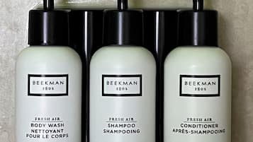 Three bottles of Beekman 1802 fresh air body wash, shampoo, and conditioner.