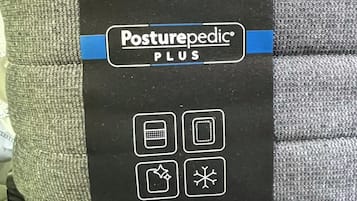 A package of Sealy Posturepedic PLUS bedding.