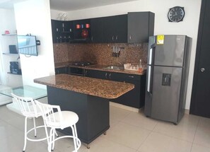 Fridge, microwave, stovetop, cookware/dishes/utensils