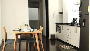 A modern kitchen with a dining area. - #Apt#Rent#Cali#Imbanaco#Tequendama#Colores#SanFernando#Travel#Colombia#Vacation (Cali)