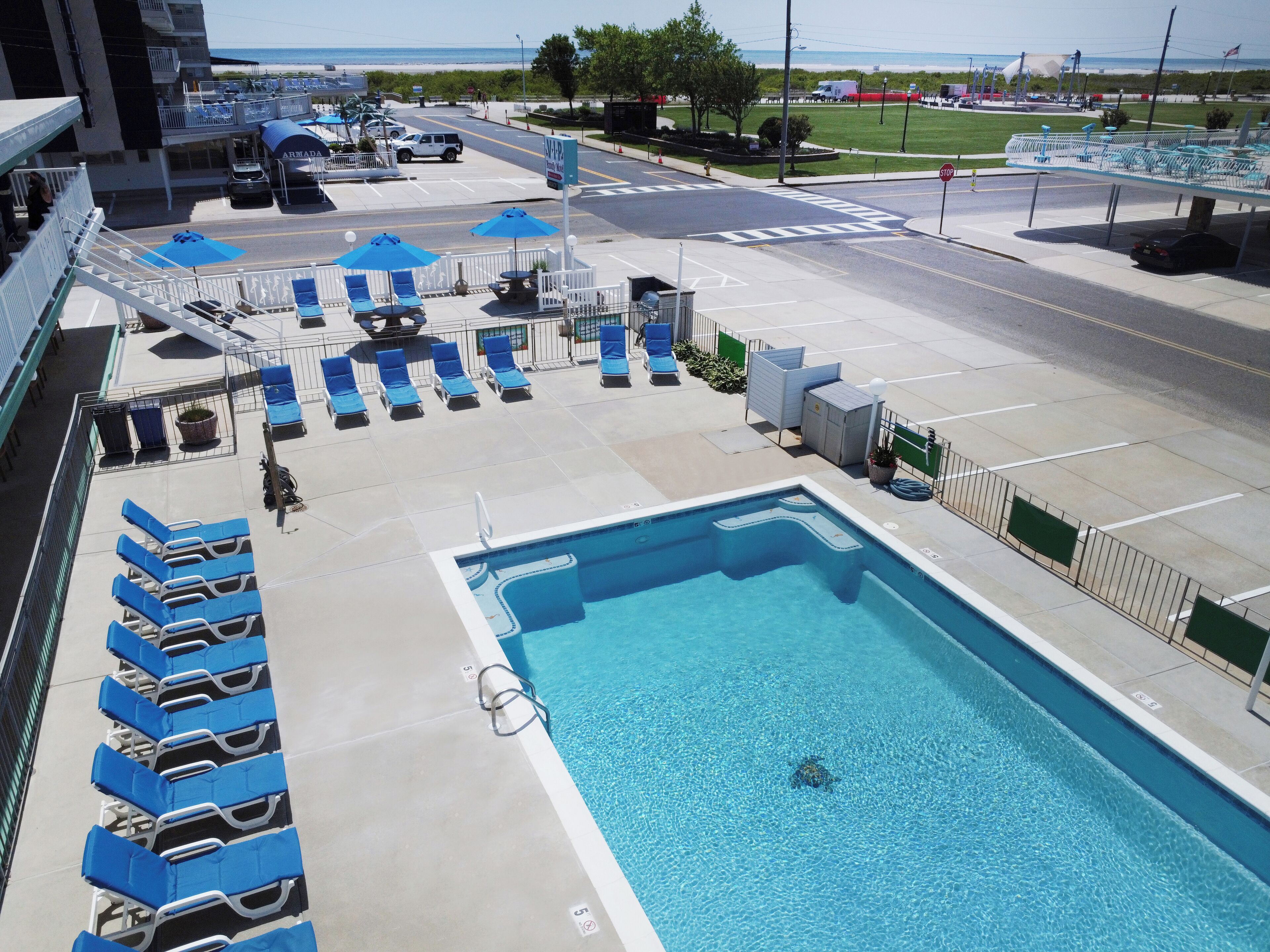Seasonal outdoor pool, open 9:00 AM to 8:00 PM, sun loungers