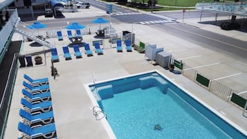 Seasonal outdoor pool, open 9:00 AM to 8:00 PM, pool loungers