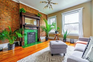 Jungle Book | Living area | 55-inch Smart TV with digital channels, Netflix, Hulu - The Parkside by Jungle House – Short North Boutique Suites (Columbus)