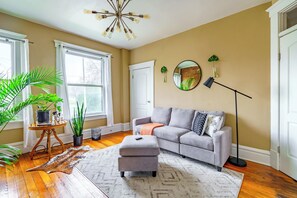 Jungle Book | Living area | 55-inch Smart TV with digital channels, Netflix, Hulu - The Parkside by Jungle House – Short North Boutique Suites (Columbus)