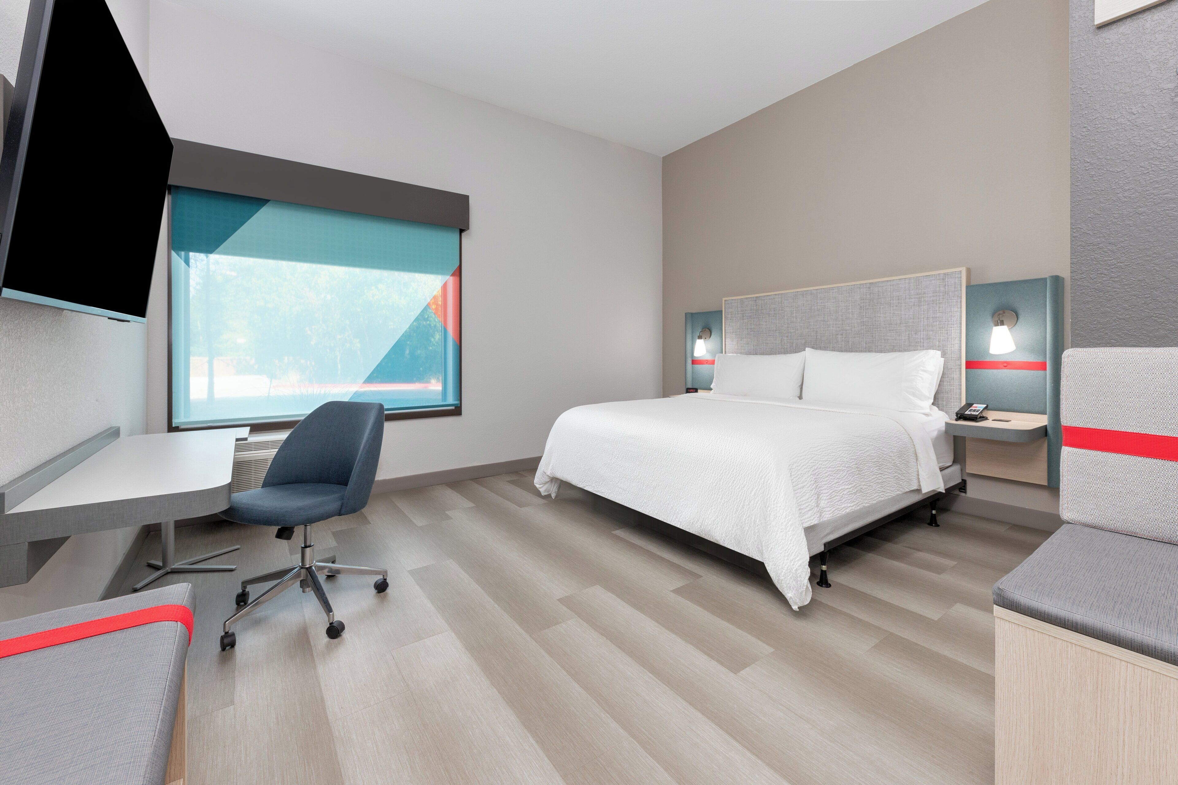 Desk, laptop workspace, blackout drapes, free cribs/infant beds