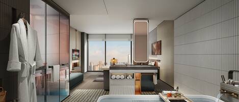 A modern bathroom with a large bathtub, a vanity with a mirror, and a view of the city skyline.