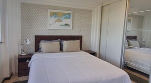 2 quartos, ferros/tábuas de passar roupa, roupa de cama