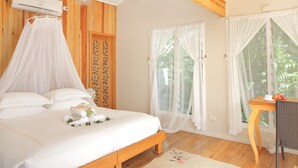 A bedroom with a bed, a wooden wardrobe, a desk, and a chair. - Private Resort Book Out   Rent Entire Resort for 12 16 PAX (Somosomo)