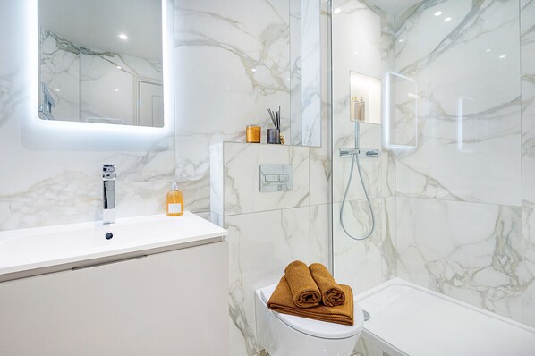 Bathtub, hair dryer, towels