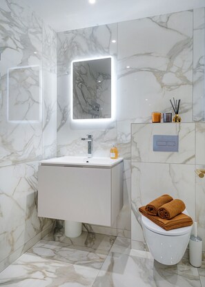 Bathtub, hair dryer, towels