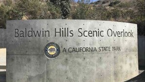 A concrete sign with the text "Baldwin Hills Scenic Overlook" and "A California State Park" indicating a park entrance. - Bright and Charming Guest House (10 mins from LAX) (Los Angeles)
